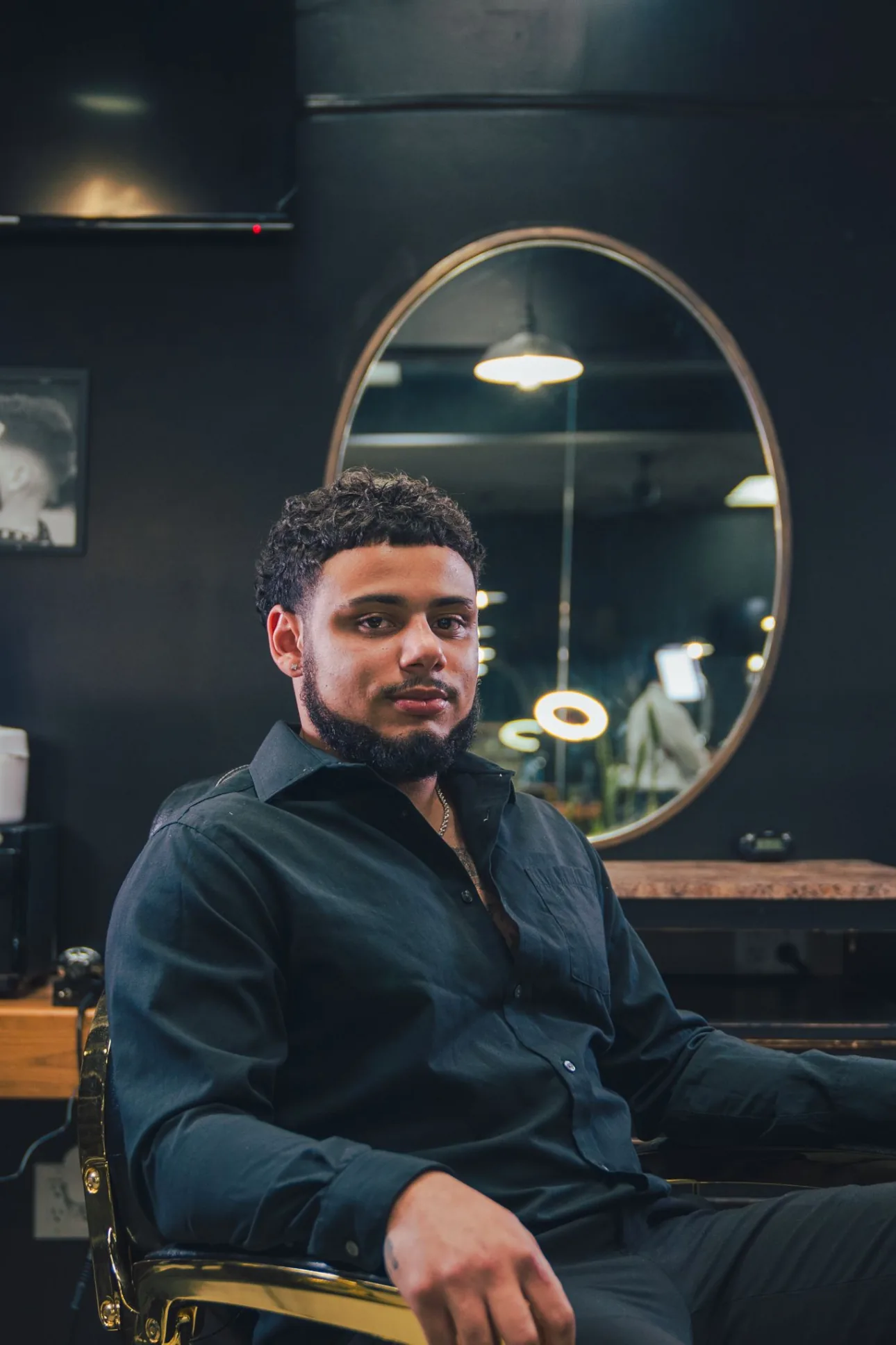 Jasiah Powers in his barber chair, clippers down.